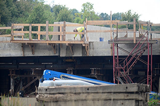 This bridge along the Pennsylvania turnpike will be slid into place over the weekend. The replacement bridge sits along side the roadway, with the equipment sitting below it along Brush Creek Road in New Sewickley Township.