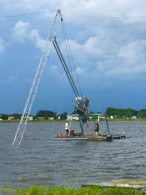 The first cable tower is lifted at the new Elite Cable Park at the USA Water Sports Complex on Lake Myrtle. Teams from Aktion Parks and Rixen U.S. worked on the project. [SPECIAL TO THE LEDGER]