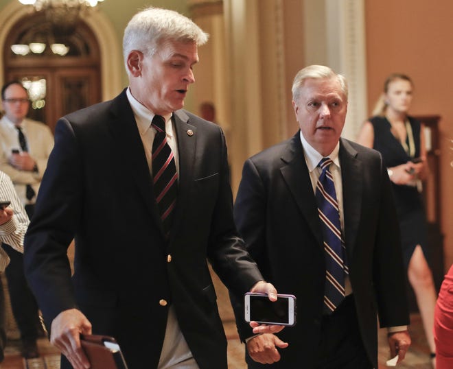 In this July 13 file photo, Sen. Bill Cassidy, R-La., left, and Sen. Lindsey Graham, R-S.C., right, talk while walking to a meeting on Capitol Hill in Washington. Senate Republicans are planning a final, uphill push to erase President Barack Obama's health care law. But Democrats and their allies are going all-out to stop the drive. The initial Republican effort crashed in July in the GOP-run Senate. Majority Leader Mitch McConnell said after that defeat that he'd not revisit the issue without the votes to succeed. Graham and Cassidy are leading the new GOP charge and they'd transform much of Obama's law into block grants and let states decide how to spend the money. [AP PHOTO]