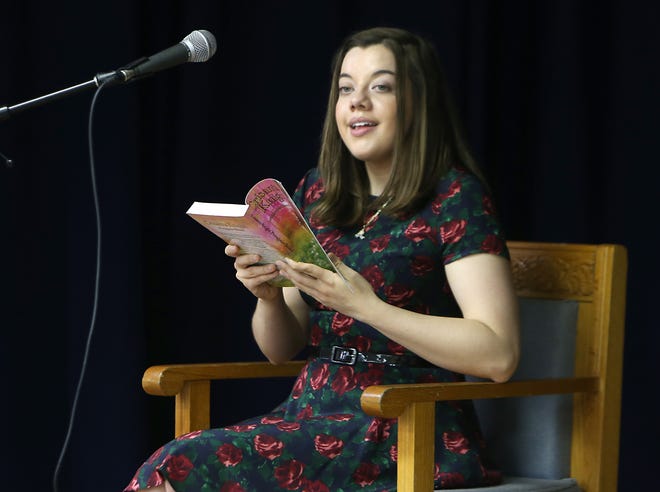 Author Geanna Culbertson reads the prologue for her book “Crisanta Knight: Protagonist Bound” to Holy Nativity Episcopal middle school students on Monday in Panama City. [PATTI BLAKE/THE NEWS HERALD]