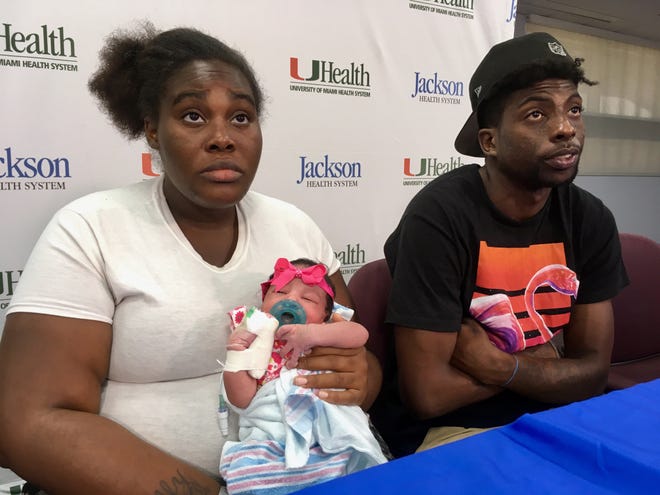 Tatyanna Watkins and her boyfriend, David Knight, hold a news conference Sept. 13 at Miami's Jackson Memorial Hospital to discuss the birth of their daughter, Destiny Knight. She was born Sept. 10 as Hurricane Irma was approaching south Florida. (AP Photo/Adriana Gomez Licon)