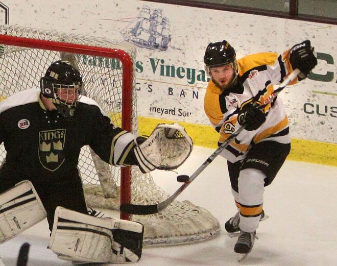 In this file photo from last year, Cape Cod Islanders player Anthony Giannelli (right) used his stick to knock a puck in the goal.