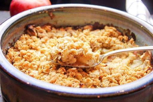 This Sept. 10, 2017 photo shows a fall apple crumble with rosemary and chia seeds in Bethesda, Md. This dish is from a recipe by Melissa d’Arabian. (Melissa d’Arabian via AP)