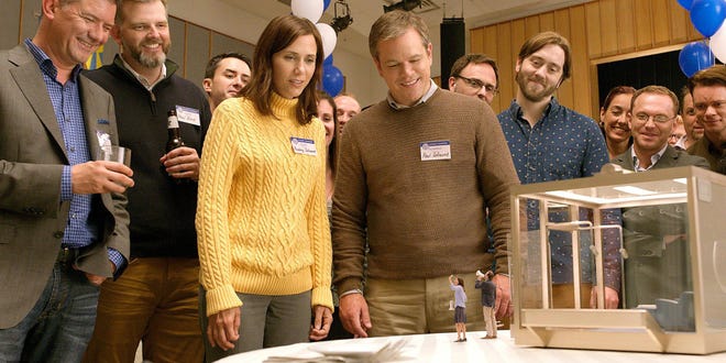 Kristen Wig and Matt Damon get a sneak peek at what might be their future in “Downsizing.” [Paramount Pictures]