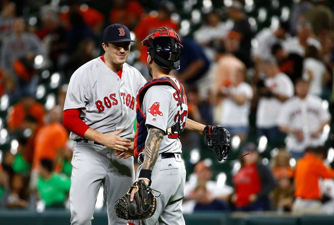 Boston's Carson Smith, left, celebrates with catcher Blake Swihart after the final out of Monday night's win in Baltimore.