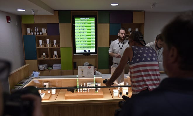 Customers received 25 percent off during the grand opening of Bradenton's Trulieve medical cannibis dispensary Tuesday at 1103 14th St. W., Bradenton. The firm has nine other dispensaries in Florida and will sell low and high THC products: capsules, vaporizers, tinctures and creams. [HERALD-TRIBUNE STAFF PHOTO / THOMAS BENDER]