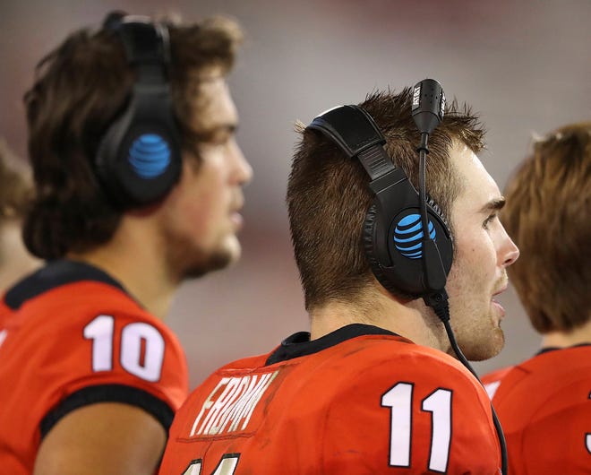 Georgia quarterbacks Jacob Eason, left, who is injured, and current starter Jake Fromm watch during the fourth quarter against Samford from the sidelines during the team’s 42-14 Saturday in Athens. (Curtis Compton/Atlanta Journal-Constitution via AP)