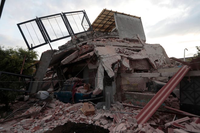 A building demolished by a 7.1 earthquake sits in pile of rubble, in Jojutla, Morelos state, Mexico, Wednesday, Sept. 20, 2017. Police, firefighters and ordinary Mexicans are digging frantically through the rubble of collapsed schools, homes and apartment buildings, looking for survivors of Mexico’s deadliest earthquake in decades as the number of confirmed fatalities climbed to 248. (AP Photo/Eduardo Verdugo)