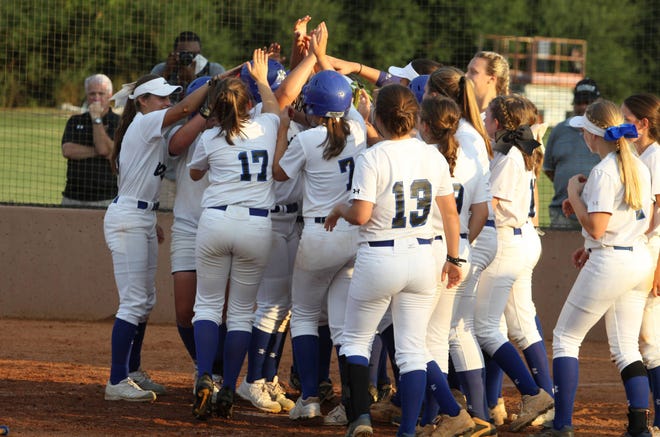 Oconee County celebrates Kailey Adcock’s three-run home run against North Oconee in the bottom of the sixth inning Thursday, September 21, 2017 at Lady Warrior Field (photo by Matthew Caldwell)