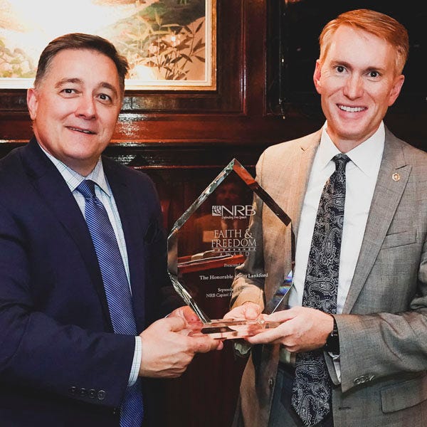 Jerry A. Johnson, National Religious Broadcasters president and chief executive officer, presents the organization's "Faith & Freedom Award" to U.S. Sen. James Lankford, R-Oklahoma City, at the group's Capitol Hill Media Summit in Washington, D.C. [Photo provided]
