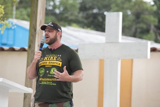 Shane Johnson speaks Thursday at the Panama City Rescue Mission as part of his Hike Across America for Homeless Veterans tour. [JOSHUA BOUCHER/THE NEWS HERALD]