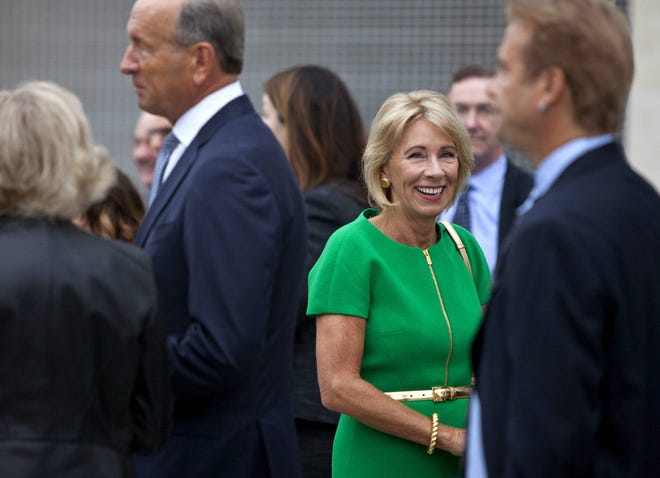U.S. Education Secretary Betsy DeVos arrives at the dedication ceremony of Michigan State University’s new Grand Rapids Medical Research Center on Wednesday, Sept. 20, 2017, in Grand Rapids, Mich. (Cory Morse /The Grand Rapids Press via AP)