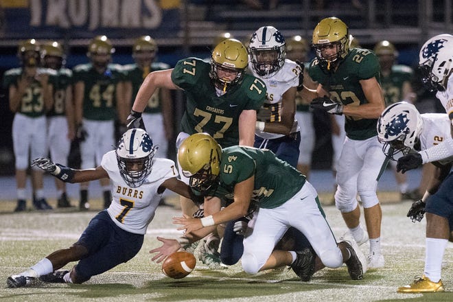 West Catholic's Wilbert Mulbah (7) and Lansdale Catholic's Matt Brulenski (54) dive after a loose ball in the third quarter Friday, Sept. 22, 2017, in Ambler. Mulbah was credited with the turnover.