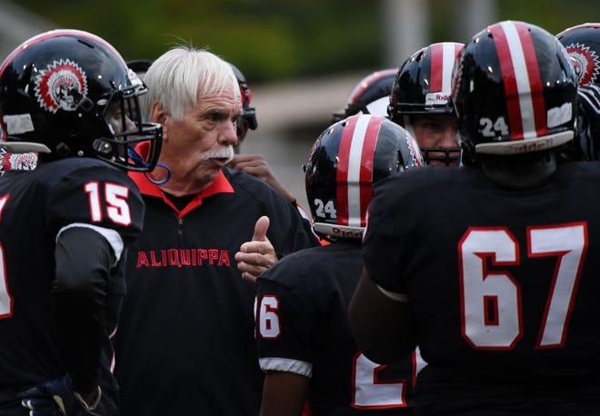 Aliquippa head coach Mike Zmijanac talks to his players during a timeout in Aliquippa's 36-0 win over Beaver Falls.
