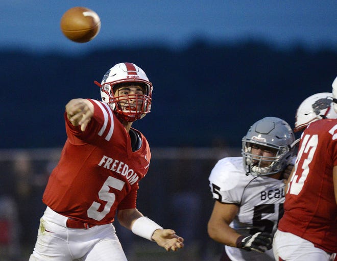 Freedom quarterback Zach Rosa (5) threw for two touchdowns in the Bulldogs' 42-20 win over Laurel Friday.