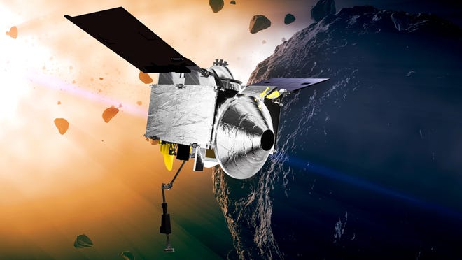 This illustration provided by NASA depicts the OSIRIS-REx spacecraft at the asteroid Bennu. The rocky remnant from the dawn of the solar system may hold clues to the origins of life. On Friday, Sept. 22, 2017, the probe will use Earth's gravity to put it on a path toward Bennu. (Conceptual Image Lab/Goddard Space Flight Center/NASA via AP)