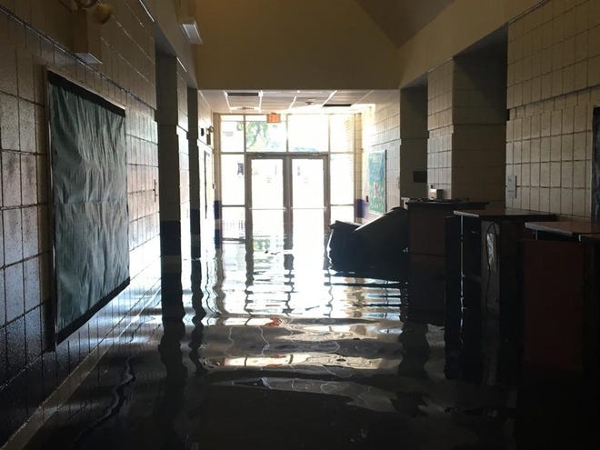 A flooded hallway at Princeville Elementary School in Edgecombe County after Hurricane Matthew on Oct. 13, 2016. The devastation displaced almost 900 students from their homes and the school system had two shelters set up for the community. [Edgecombe County Public Schools/Special to The Gazette]