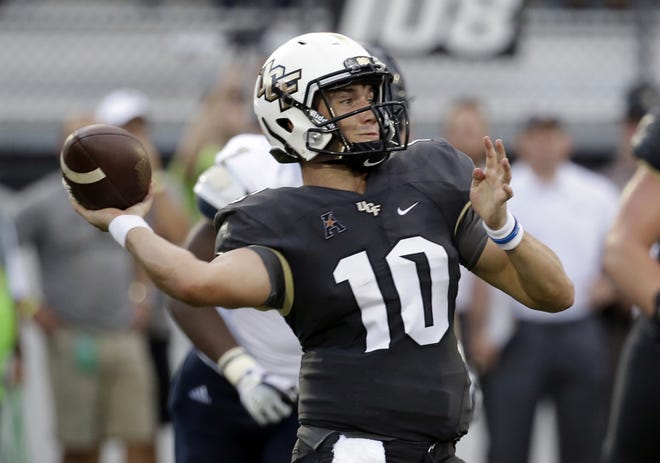 Central Florida quarterback McKenzie Milton will finally get to throw another in-game pass 23 days after winning the season opener as Central Florida takes on Maryland. [FILE/THE ASSOCIATED PRESS]