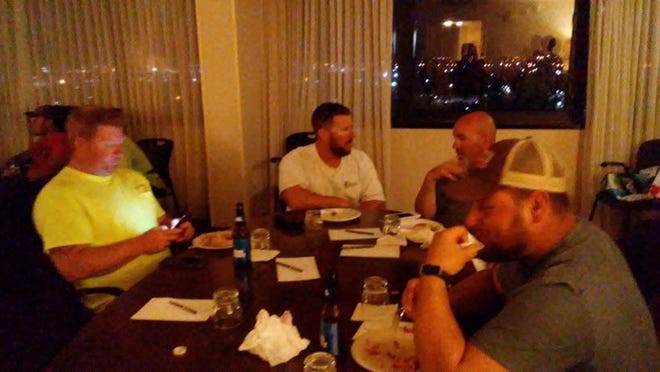 A group of lineman enjoy dinner on Sept. 16 at Embassy Suites in West Palm Beach co-organized by Lake Worth resident Meredith Abrams. (Contributed)