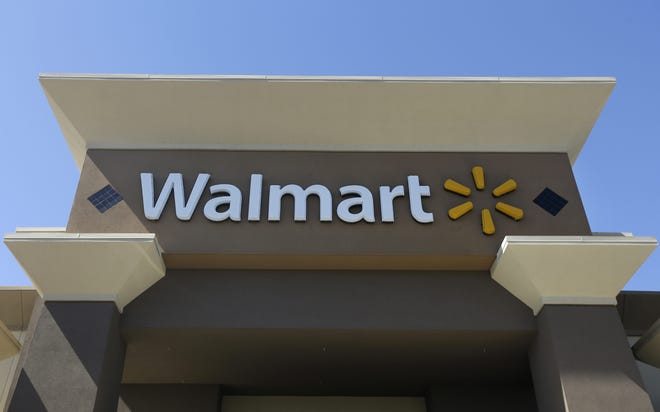 This Sept. 19, 2013 photo shows the sign of a Walmart store in San Jose, Calif. (AP Photo/Jeff Chiu)