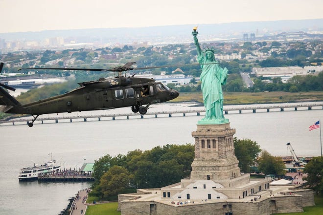 A UH-60 Black Hawk helicopter belonging to the 82nd Combat Aviation Brigade, 82nd Airborne Division at Fort Bragg, flies over New York earlier this week. Helicopter crews are in New York to support the United Nations General Assembly. [U.S. Army Spc. Cris Bates for The Fayetteville Observer]