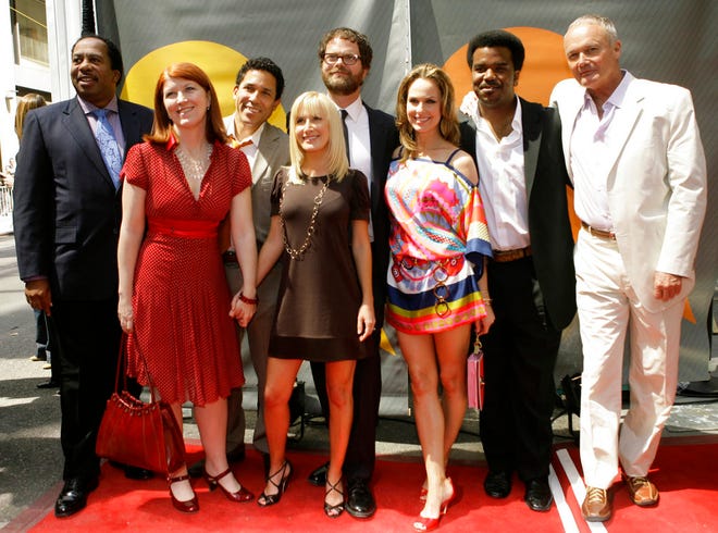 In this May 14, 2007 photo, the cast of "The Office" poses for photographers on the red carpet during the arrivals for NBC's 2007-08 preview in New York. The AP reported on Sept. 22 that a story claiming the sitcom was set to return was false. (AP Photo/Mary Altaffer, File)