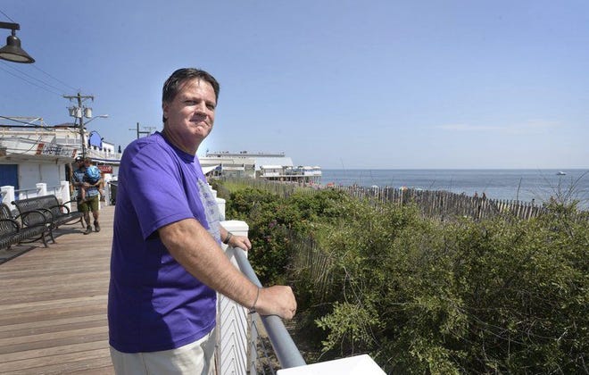 Quincy native Michael McCormack, who is suffering from early onset of Alzheimers, loves to see the ocean every day and to walk along the shore and here at the new boardwalk.