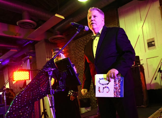 StarNews Publisher Mike Distelhorst and Cape Fear Literacy Council Executive Director Yasmin Tomkinson greet the crowd during the Cape Fear Literacy Council/StarNews Media gala to celebrate the StarNews 150th anniversary on Saturday Sept. 23, 2017 at the Coastline Convention Center in Wilmington, N.C. [KEN BLEVINS/STARNEWS]