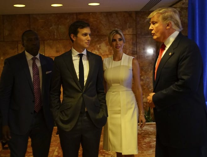 Jared Kushner, left, is seen in 2015 with wife Ivanka and father-in-law Donald Trump.