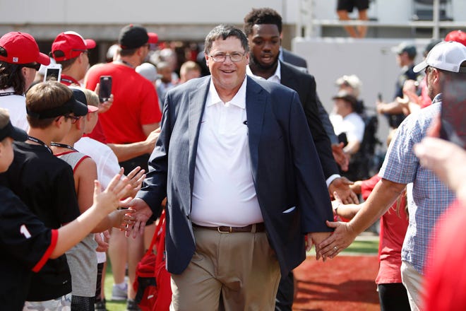 UGA offensive coordinator Jim Chaney inters Sanford Stadium during the Dawg Walk before a NCAA college football game between Georgia and Appalachian State in Athens, Ga., Saturday, Sept. 2, 2013. (Photo/Joshua L. Jones, Athens Banner-Herald)