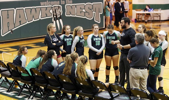 South Walton head volleyball coach Chad Mercado talks to his team between games against Pensacola Catholic. [MICHAEL SNYDER/DAILY NEWS]