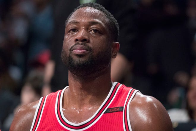This April 8, 2017 photo shows Chicago Bulls guard Dwyane Wade (3) as he watches game action from the bench against the Brooklyn Nets in New York.