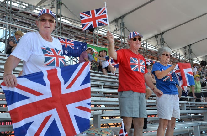 British rowing fans, from left, Sheila Hartley and Brian and Marjorie Duerden cheer from the grandstands as Victoria Thornley wins her heat in the women's single sculls on Monday at the 2017 World Rowing Championships at Nathan Benderson Park in Sarasota.  The Duerdens have owned a condo nearby in The Meadows for 20 years and said they have watched Benderson Park as it was developed. They bought a week-long pass to watch the races all week.  [Herald-Tribune staff photo / Mike Lang]
