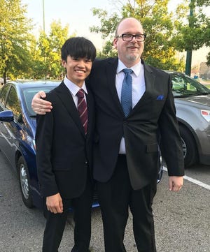 Exchange student Shodai Okamoto stands with his host dad, Michael Greenfield. [PHOTO COURTESY OF BETH GREENFIELD]