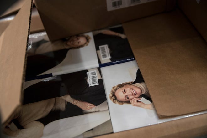 A box of Hillary Clinton's book "What Happened" are staged to be distributed outside the Warner Theatre in Washington, Monday, Sept. 18, 2017, as Clinton participates in a book tour event hosted by the Politics and Prose Bookstore.