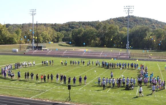 The balloon launch at the third annual Suicide Prevention Walk at Lee Stadium in Newcomerstown Sunday