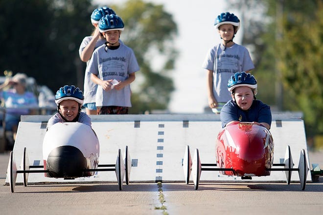 A pair of competitors leaves the starting line of the annual Downhill Derby on Saturday morning in Monmouth. [STEVE DAVIS/Review Atlas]