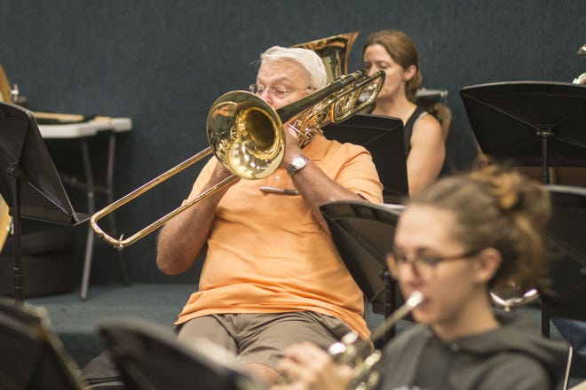 Trombone player Bob Lowder has been in the Gaston County Symphony Band for nine years. 'Getting to share my love of music with other people is why I love this band,' said Lowder. This year, the band is celebrating 25 years. [BY DEMETRIA MOSLEY/THE GASTON GAZETTE]