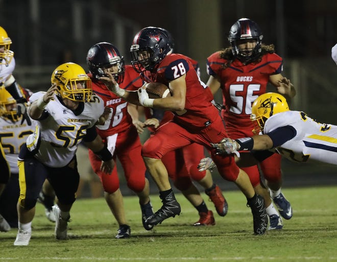 Bozeman's Hunter Kruger (28) runs the ball against Sneads during a game thi season. [HEATHER HOWARD | NEWS HERALD FILE PHOTO]