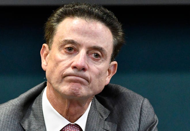 In this Oct. 20, 2016, file photo, Louisville coach Rick Pitino reacts to a question during an NCAA college basketball press conference in Louisville, Ky. Louisville announced Wednesday, Sept. 27, 2017, that they have placed basketball coach Rick Pitino and athletic director Tom Jurich on administrative leave amid an FBI probe. (AP Photo/Timothy D. Easley, File)