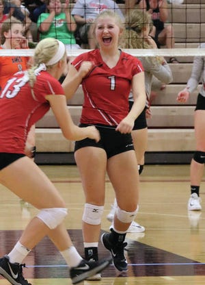 Jessica Lewis pumps her fist after Boone wins a point during last weekend’s tournament. Lewis is averaging more than five assists per set. Photo by Andrew Logue/News-Republican