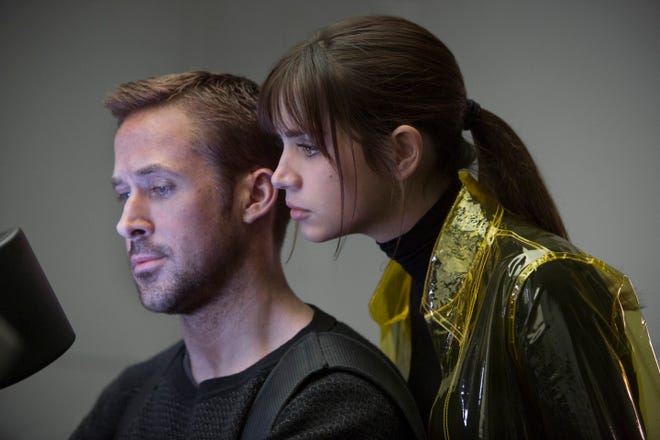Joi (Ana de Armas) works together with K (Ryan Gosling) to solve a mystery. [Stephen Vaughan]