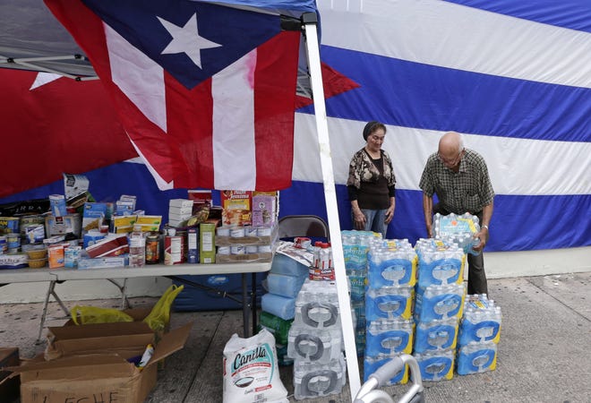 Local organizations and individuals are gathering supplies to be sent to Puerto Rico, and also are hosting other activites. Their efforts will support others, such as this collection drive on Wednesday in Miami. [AP Photo/Alan Diaz]