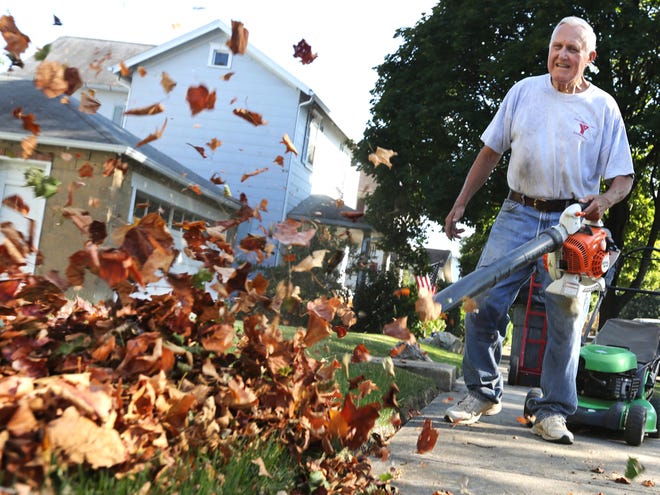 TIMES-REPORTER PAT BURK

Dale Vogel helps out clearing leaves for a resident on Cross Street in Dover Tuesday afternoon.