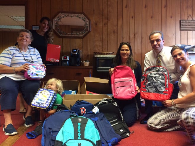 Pictured with the school supplies that Saugus Karate Kung Fu collected for the Saugus Public Schools are, from left to right, School Committee member Linda Gaieski, Rose Luongo of Saugus Karate Kung Fu, Ben Luongo, 4, School Committee Chairman Jeannie Meredith, Superintendent of Schools Dr. David DeRuosi and School Committee member Liz Marchese. Wicked local photo / mike gaffney