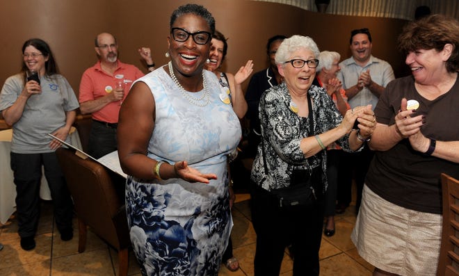 Mayoral candidate Yvonne Spicer celebrates with supporters, including Norma Shulman and Nancy Sweeney, right, at the Aegean Restaurant Tuesday night after winning the preliminary election leading the field of seven candidates. [Daily News and Wicked Local Staff Photo/Art Illman]
