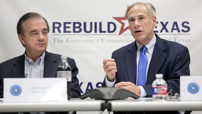 Gov. Greg Abbott, right, speaks at a briefing about Hurricane Harvey recovery efforts at the Texas-FEMA Joint Field Office on Tuesday in Austin. Texas A&M System Chancellor John Sharp, left, head of Governor’s Commission to Rebuild Texas, listens.