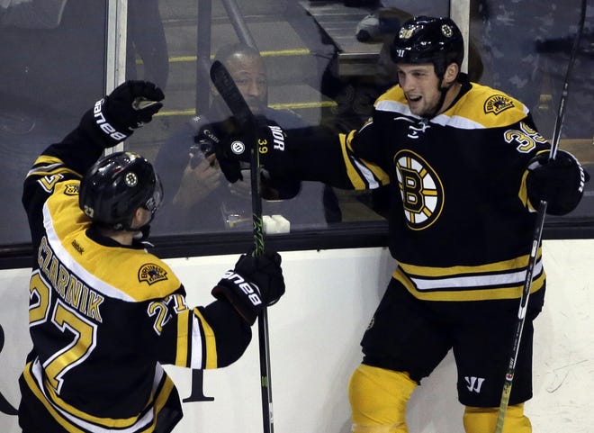 Bruins left wing Matt Beleskey (right), shown celebrating his goal with teammate Austin Czarnik against the Blue Jackeys in game last November, is playing faster this preseason after losing weight in the off-season. [AP File Photo/Elise Amendola]