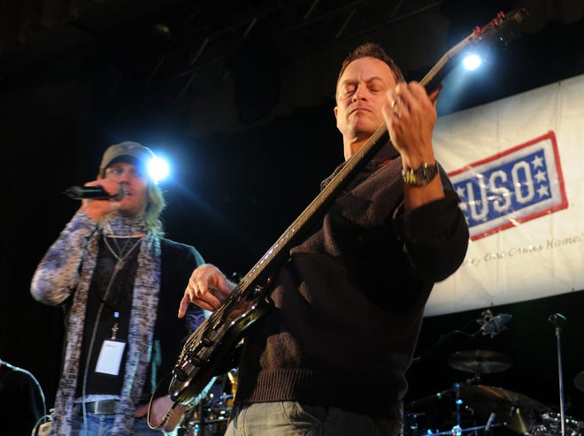 Gary Sinise, right, and the Lt. Dan Band perform at Ellsworth Air Force Base in Rapid City, S.D. in 2008. Lead singer Jeff Vezain is at left. The band will play Saturday at Eglin Air Force Base. [AP FILE PHOTO]