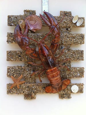 Ross Jones works in a unique medium for his art, crustacean taxidermy. [SPECIAL TO THE SUN]
